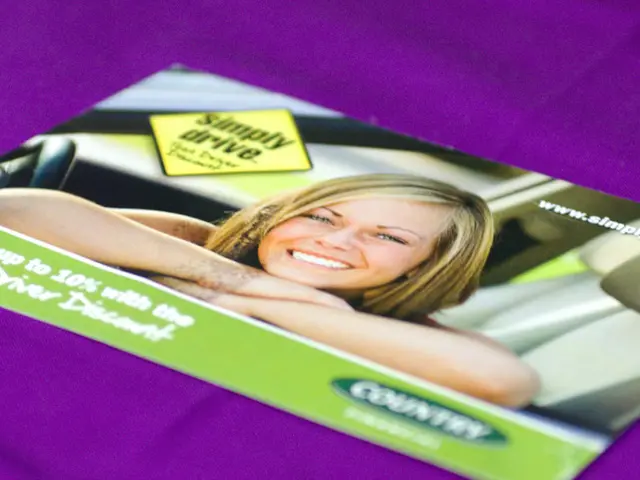 In this image I can see a purple colour cloth and on it I can see a pamphlet. On the pamphlet I can...