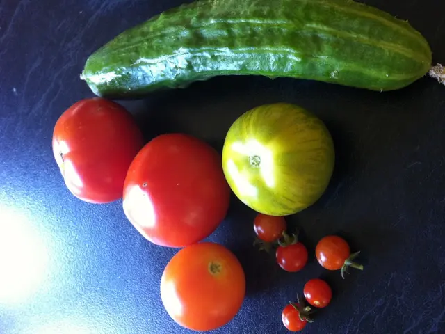 In this image there are fruits and vegetables on a surface.